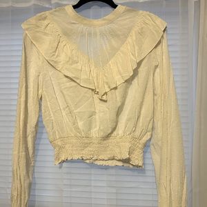 Large, cream blouse